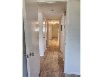 GROUND FLOOR 2 bedroom/2 bath condo on WEST side of Belcher that on On Top Of The World Golf Course in Florida - for sale on GolfHomes.com, golf home, golf lot