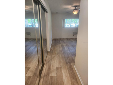 GROUND FLOOR 2 bedroom/2 bath condo on WEST side of Belcher that on On Top Of The World Golf Course in Florida - for sale on GolfHomes.com, golf home, golf lot