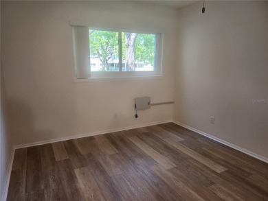 GROUND FLOOR 2 bedroom/2 bath condo on WEST side of Belcher that on On Top Of The World Golf Course in Florida - for sale on GolfHomes.com, golf home, golf lot