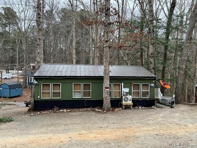 Large 2 lot, 2 bedroom, 1 bath home. Large back deck for on River Ridge Golf Club in Virginia - for sale on GolfHomes.com, golf home, golf lot