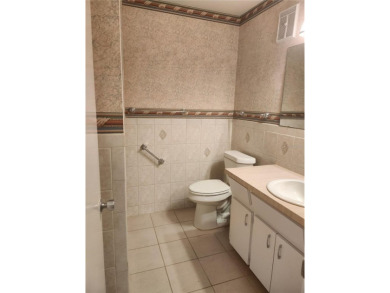 GROUND FLOOR 2 bedroom/2 bath condo on WEST side of Belcher that on On Top Of The World Golf Course in Florida - for sale on GolfHomes.com, golf home, golf lot