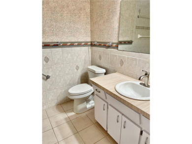 GROUND FLOOR 2 bedroom/2 bath condo on WEST side of Belcher that on On Top Of The World Golf Course in Florida - for sale on GolfHomes.com, golf home, golf lot