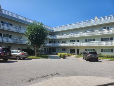GROUND FLOOR 2 bedroom/2 bath condo on WEST side of Belcher that on On Top Of The World Golf Course in Florida - for sale on GolfHomes.com, golf home, golf lot