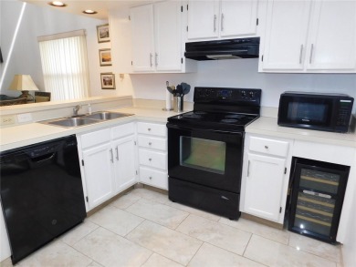 Come home every evening, relax on your screen enclosed oversized on East Lake Woodlands Country Club in Florida - for sale on GolfHomes.com, golf home, golf lot
