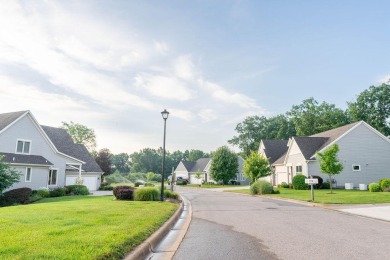 Welcome home to low maintenance condo living just steps away on Angels Crossing Golf Club in Michigan - for sale on GolfHomes.com, golf home, golf lot