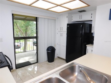Come home every evening, relax on your screen enclosed oversized on East Lake Woodlands Country Club in Florida - for sale on GolfHomes.com, golf home, golf lot