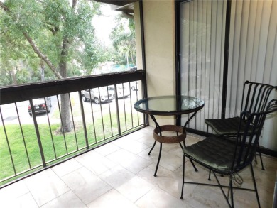 Come home every evening, relax on your screen enclosed oversized on East Lake Woodlands Country Club in Florida - for sale on GolfHomes.com, golf home, golf lot