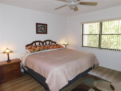 Come home every evening, relax on your screen enclosed oversized on East Lake Woodlands Country Club in Florida - for sale on GolfHomes.com, golf home, golf lot