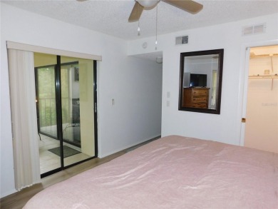 Come home every evening, relax on your screen enclosed oversized on East Lake Woodlands Country Club in Florida - for sale on GolfHomes.com, golf home, golf lot