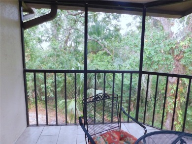Come home every evening, relax on your screen enclosed oversized on East Lake Woodlands Country Club in Florida - for sale on GolfHomes.com, golf home, golf lot