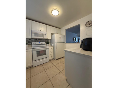 One bedroom one and a half bedroom condo in resort like + on Sunrise Lakes Phase III in Florida - for sale on GolfHomes.com, golf home, golf lot