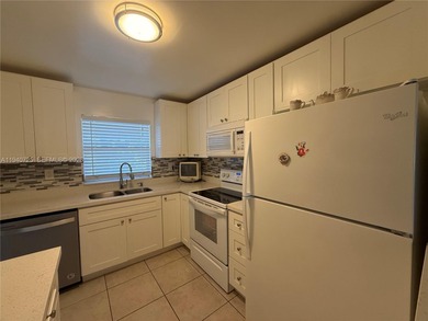 One bedroom one and a half bedroom condo in resort like + on Sunrise Lakes Phase III in Florida - for sale on GolfHomes.com, golf home, golf lot