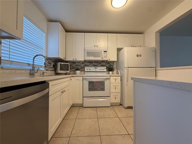 One bedroom one and a half bedroom condo in resort like + on Sunrise Lakes Phase III in Florida - for sale on GolfHomes.com, golf home, golf lot