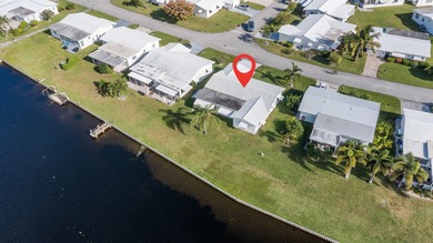 Nestled along a navigable 15+ mile waterway stretching from on Leisureville Community Golf Course in Florida - for sale on GolfHomes.com, golf home, golf lot
