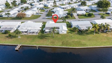 Nestled along a navigable 15+ mile waterway stretching from on Leisureville Community Golf Course in Florida - for sale on GolfHomes.com, golf home, golf lot