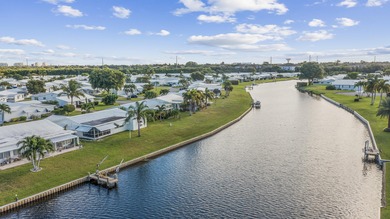 Nestled along a navigable 15+ mile waterway stretching from on Leisureville Community Golf Course in Florida - for sale on GolfHomes.com, golf home, golf lot