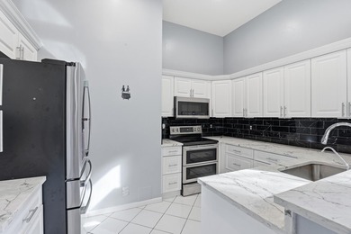 Enjoy relaxed South Florida living in this inviting 3-bedroom on Boca Delray Golf and Country Club in Florida - for sale on GolfHomes.com, golf home, golf lot