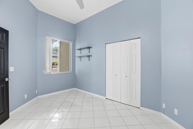 Enjoy relaxed South Florida living in this inviting 3-bedroom on Boca Delray Golf and Country Club in Florida - for sale on GolfHomes.com, golf home, golf lot