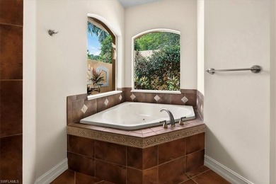 Lakefront and beautifully crafted, this custom-built home sits on Imperial Golf Club in Florida - for sale on GolfHomes.com, golf home, golf lot