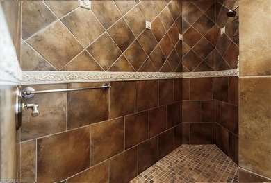 Lakefront and beautifully crafted, this custom-built home sits on Imperial Golf Club in Florida - for sale on GolfHomes.com, golf home, golf lot