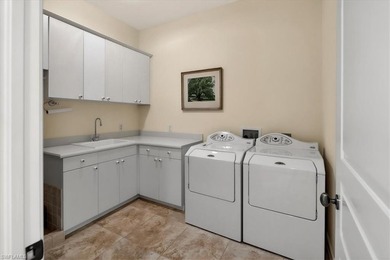 Lakefront and beautifully crafted, this custom-built home sits on Imperial Golf Club in Florida - for sale on GolfHomes.com, golf home, golf lot