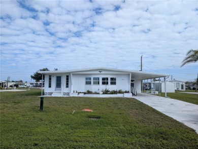 This spacious 3-bedroom, 2-bathroom mobile home offers over 1 on Oyster Creek Golf Club in Florida - for sale on GolfHomes.com, golf home, golf lot