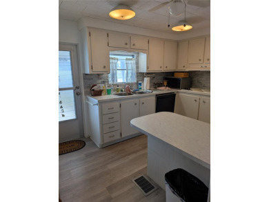 This spacious 3-bedroom, 2-bathroom mobile home offers over 1 on Oyster Creek Golf Club in Florida - for sale on GolfHomes.com, golf home, golf lot