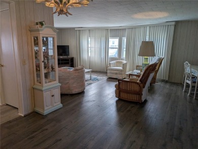 This spacious 3-bedroom, 2-bathroom mobile home offers over 1 on Oyster Creek Golf Club in Florida - for sale on GolfHomes.com, golf home, golf lot