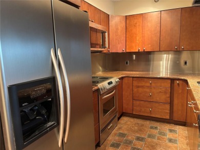 This spacious third-floor end unit offers true resort-type on Feather Sound Country Club in Florida - for sale on GolfHomes.com, golf home, golf lot