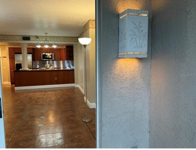This spacious third-floor end unit offers true resort-type on Feather Sound Country Club in Florida - for sale on GolfHomes.com, golf home, golf lot
