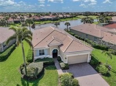 Breathtaking Lake & Sunset Views | Maintenance-Free Luxury on Venetian Golf and River Club in Florida - for sale on GolfHomes.com, golf home, golf lot