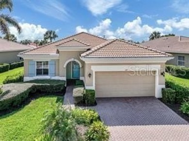 Breathtaking Lake & Sunset Views | Maintenance-Free Luxury on Venetian Golf and River Club in Florida - for sale on GolfHomes.com, golf home, golf lot