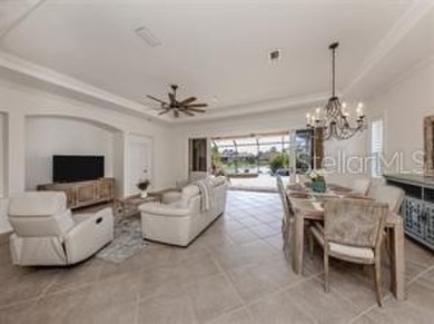 Breathtaking Lake & Sunset Views | Maintenance-Free Luxury on Venetian Golf and River Club in Florida - for sale on GolfHomes.com, golf home, golf lot