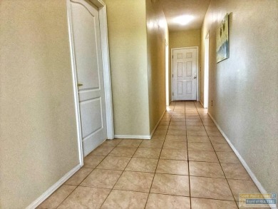 Enjoy panoramic views of the lake and golf course from this on South Padre Island Golf Club in Texas - for sale on GolfHomes.com, golf home, golf lot
