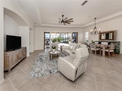 Breathtaking Lake & Sunset Views | Maintenance-Free Luxury on Venetian Golf and River Club in Florida - for sale on GolfHomes.com, golf home, golf lot