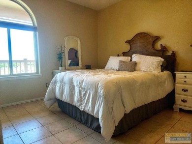 Enjoy panoramic views of the lake and golf course from this on South Padre Island Golf Club in Texas - for sale on GolfHomes.com, golf home, golf lot