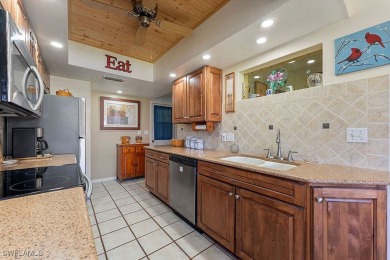 Beautiful home ideally situated 3 homes away from the community on Sabal Springs Golf and Racquet Club in Florida - for sale on GolfHomes.com, golf home, golf lot