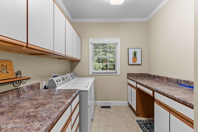 Welcome to 305 Tall Ships Lane-an impeccably maintained brick on Belvedere Country Club in North Carolina - for sale on GolfHomes.com, golf home, golf lot