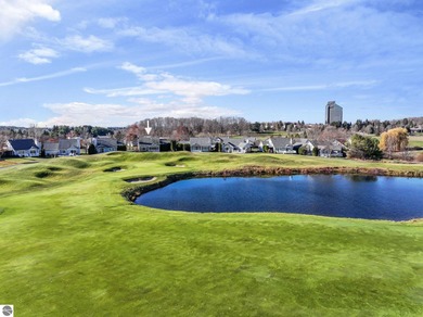 Experience affordable luxury overlooking the 15th hole of The on Grand Traverse Resort and Spa in Michigan - for sale on GolfHomes.com, golf home, golf lot