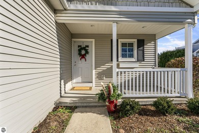 Experience affordable luxury overlooking the 15th hole of The on Grand Traverse Resort and Spa in Michigan - for sale on GolfHomes.com, golf home, golf lot