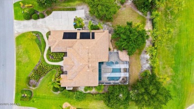 Welcome to this exquisite custom-built home located in the on Plantation Bay Golf and Country Club in Florida - for sale on GolfHomes.com, golf home, golf lot