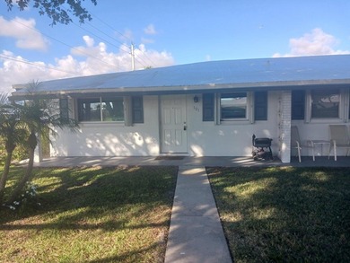 Fall in love with this 2Br/2Ba corner villa is ideally located on Leisureville Community Golf Course in Florida - for sale on GolfHomes.com, golf home, golf lot