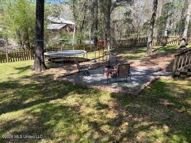 Charming 4-bedroom, 2-bath, two-story home offering over 2,000 on Diamondhead Country Club in Mississippi - for sale on GolfHomes.com, golf home, golf lot