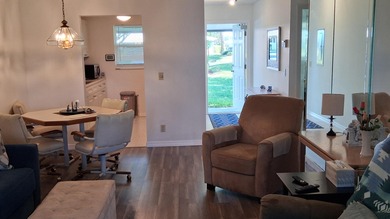 Fall in love with this 2Br/2Ba corner villa is ideally located on Leisureville Community Golf Course in Florida - for sale on GolfHomes.com, golf home, golf lot