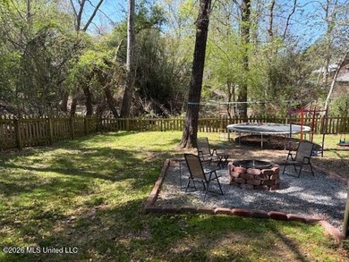 Charming 4-bedroom, 2-bath, two-story home offering over 2,000 on Diamondhead Country Club in Mississippi - for sale on GolfHomes.com, golf home, golf lot
