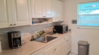 Fall in love with this 2Br/2Ba corner villa is ideally located on Leisureville Community Golf Course in Florida - for sale on GolfHomes.com, golf home, golf lot