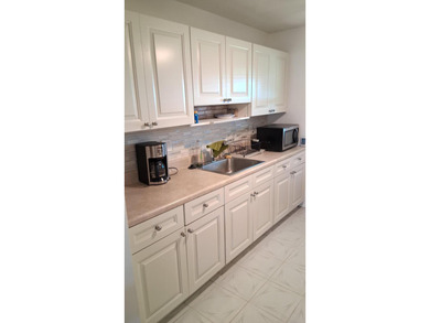 Fall in love with this 2Br/2Ba corner villa is ideally located on Leisureville Community Golf Course in Florida - for sale on GolfHomes.com, golf home, golf lot