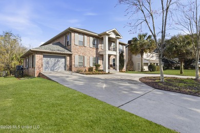 Welcome to this exceptional 4-bedroom, 5-bath custom waterfront on Sunkist Country Club, Inc. in Mississippi - for sale on GolfHomes.com, golf home, golf lot