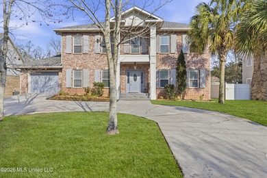 Welcome to this exceptional 4-bedroom, 5-bath custom waterfront on Sunkist Country Club, Inc. in Mississippi - for sale on GolfHomes.com, golf home, golf lot