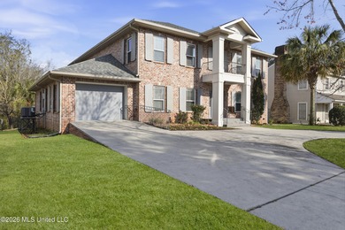 Welcome to this exceptional 4-bedroom, 5-bath custom waterfront on Sunkist Country Club, Inc. in Mississippi - for sale on GolfHomes.com, golf home, golf lot